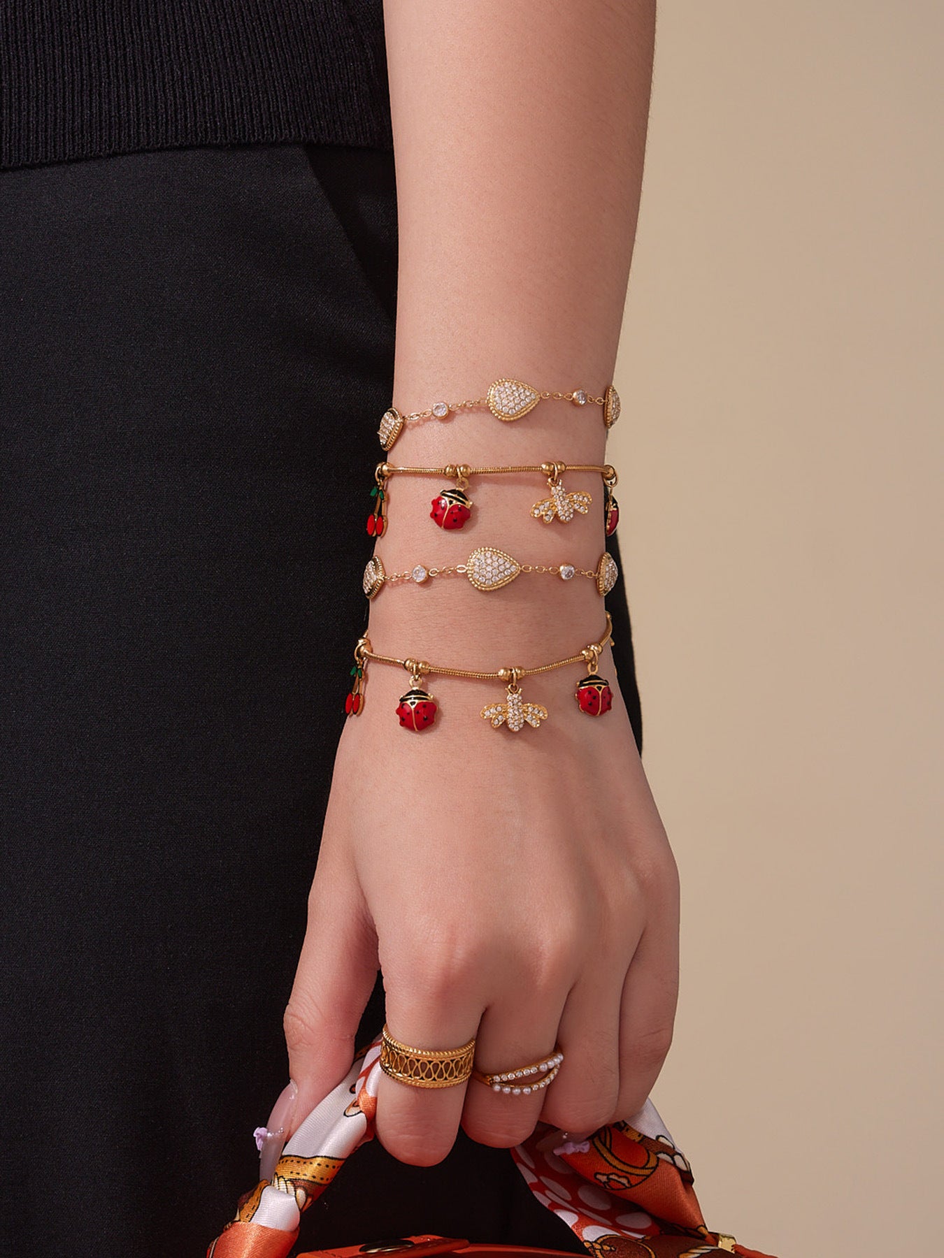 Flatlay of waterproof zircon waterdrop charm bracelets, 316L stainless steel wholesale