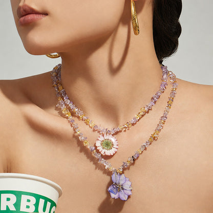 Model wearing pink and purple flower crystal necklace for romantic floral jewelry collections