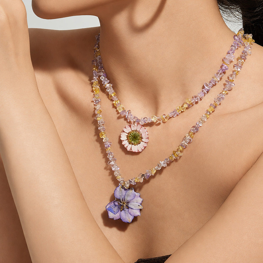 Resin flower crystal bead necklace worn on neckline for feminine boutique fashion jewelry styling
