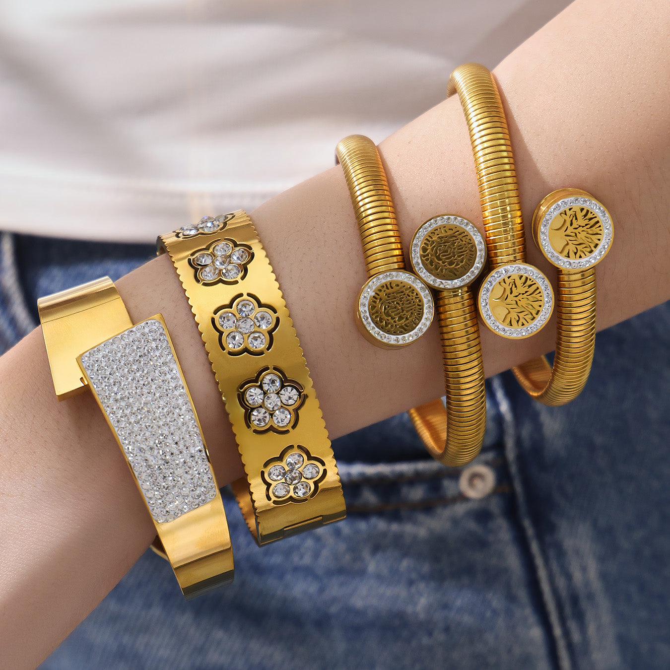 Model wearing PVD gold plated zircon flower open bangle set: stackable luxury style