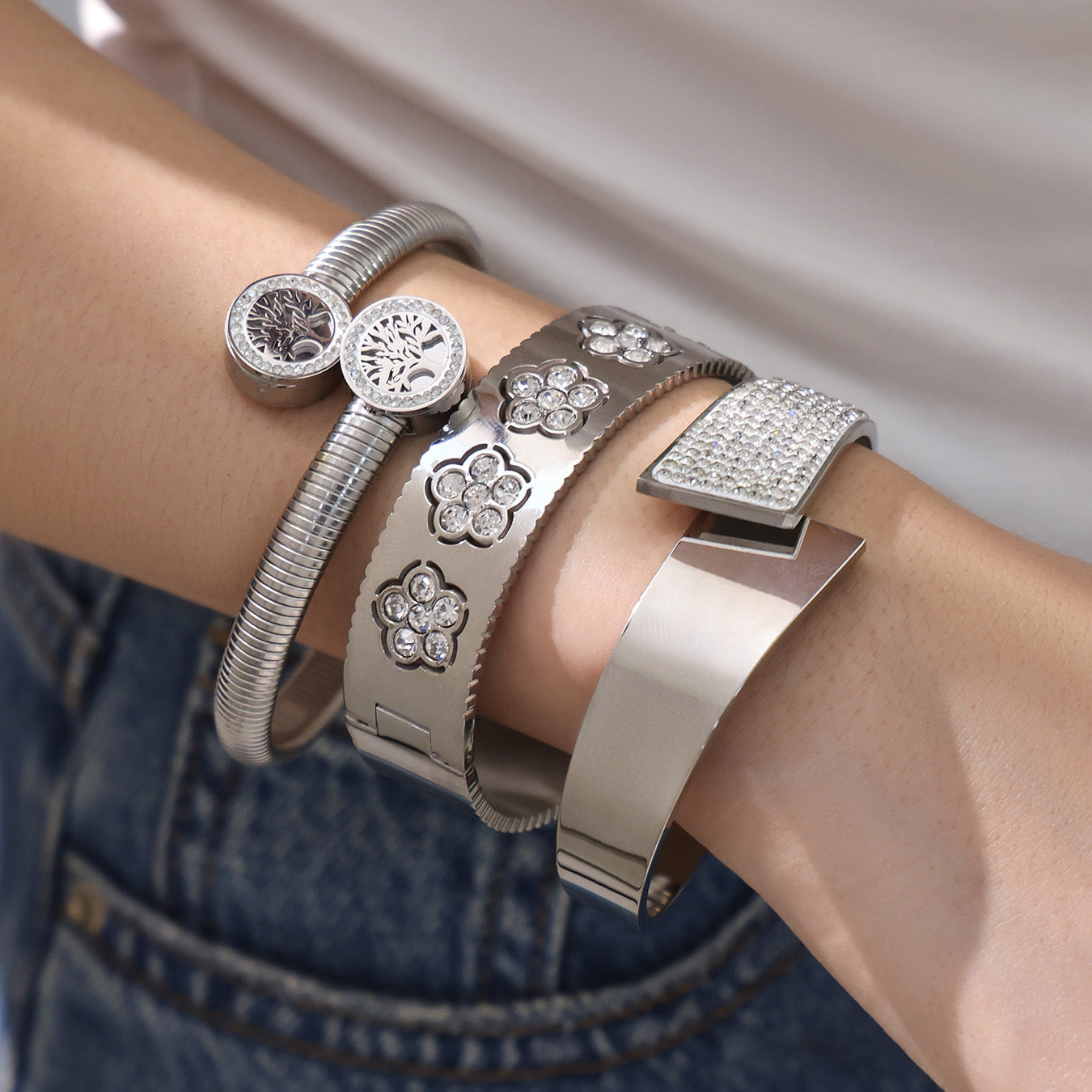 Model wearing PVD silver plated zircon flower open bangle set: minimalist elegant look