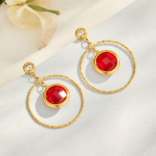 Red glass stone drop earrings with round gold-tone hoop design