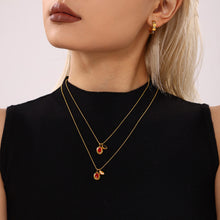 Model wearing a red zircon drop pendant necklace at the neckline