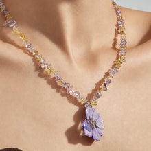 Close-up of model wearing purple resin flower necklace with crystal beads for summer gift jewelry