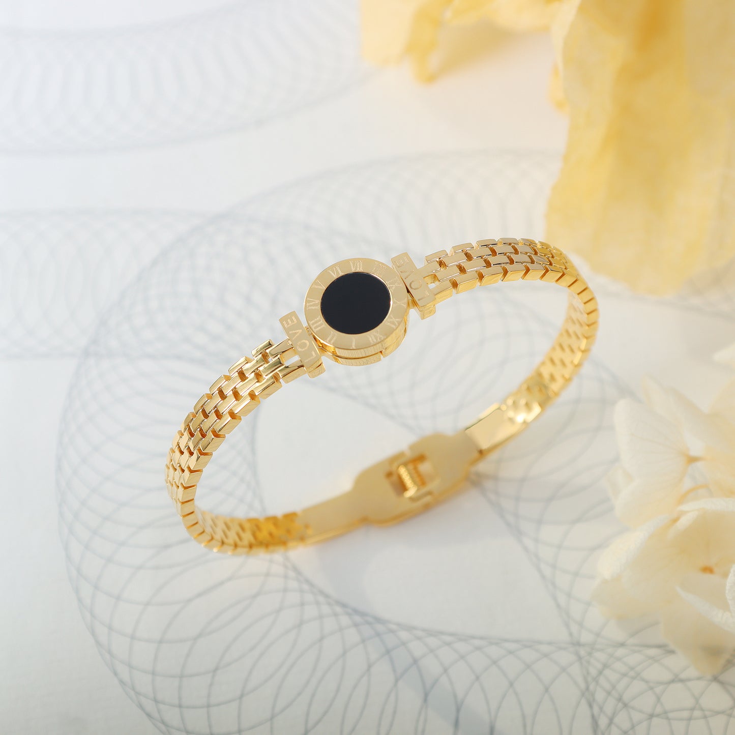 roman numeral love black stone mesh cuff bracelet detail display gold stainless steel jewelry texture close up