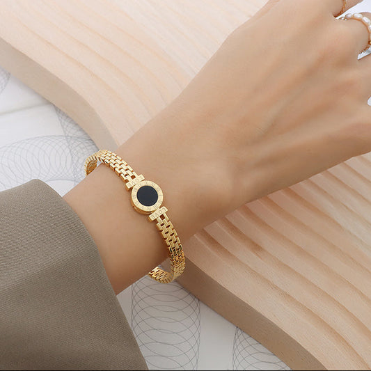 roman numeral love black stone mesh cuff bracelet model front view gold stainless steel bangle on wrist