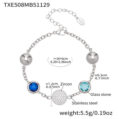 Silver tone stainless steel bracelet with blue and aqua glass stones and zircon pavé disc, size reference