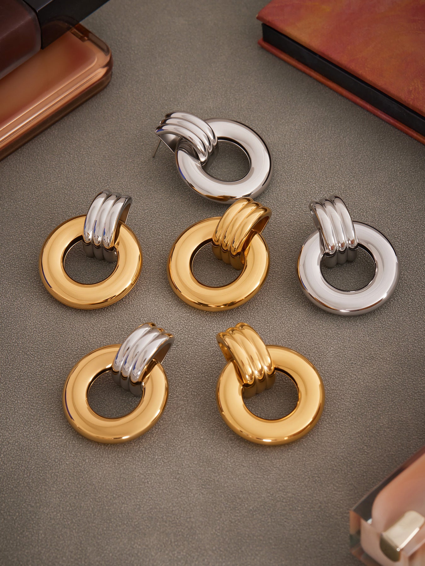 Gold, silver and two-tone round stainless steel door knocker earrings in compact and large styles