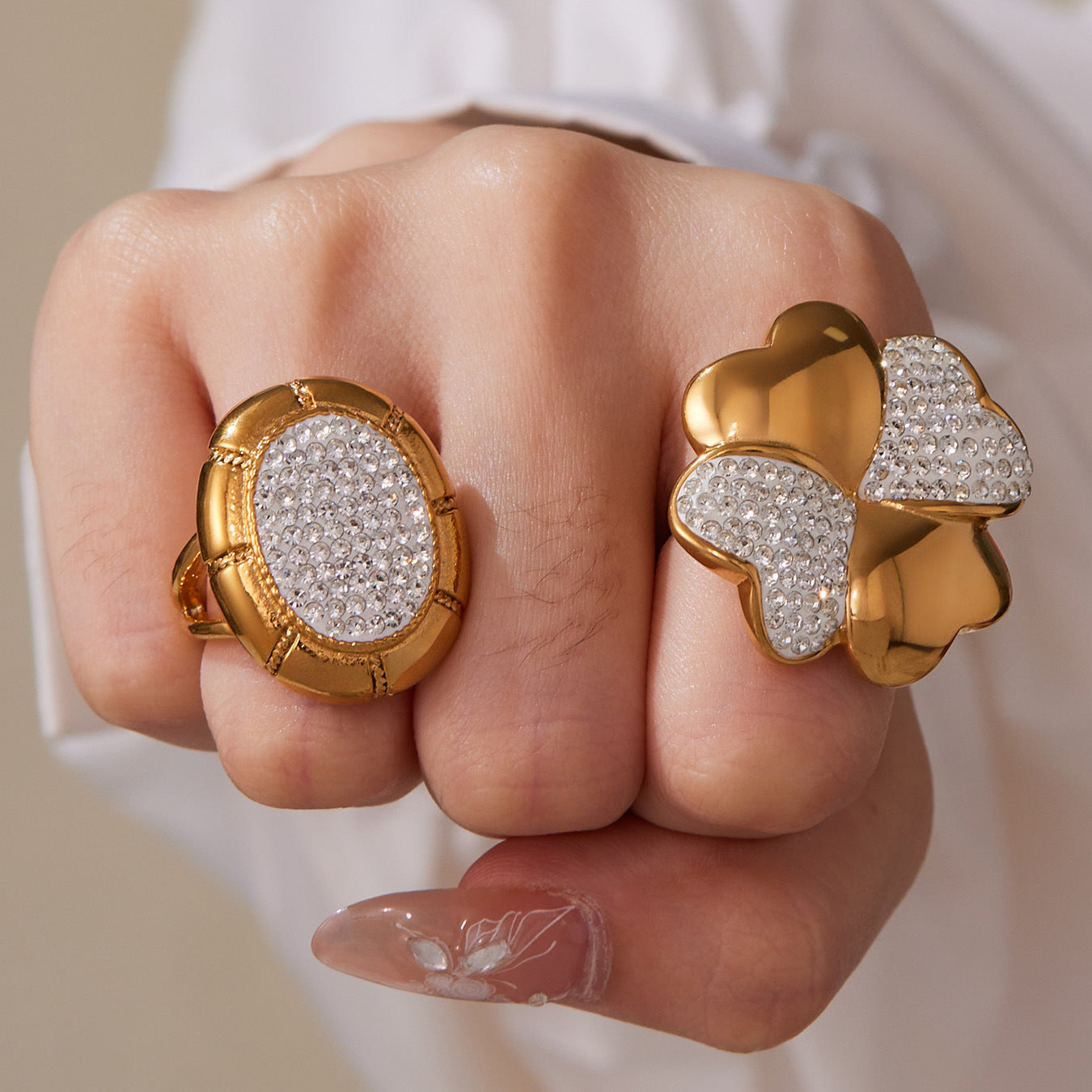 Model wearing a large round pavé statement ring with a sparkling clear stone-set face