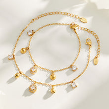 Gold tone stainless steel round and square zircon bracelets flat lay