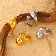 Gold-tone and steel-tone open rings with rounded asymmetric sculptural ends