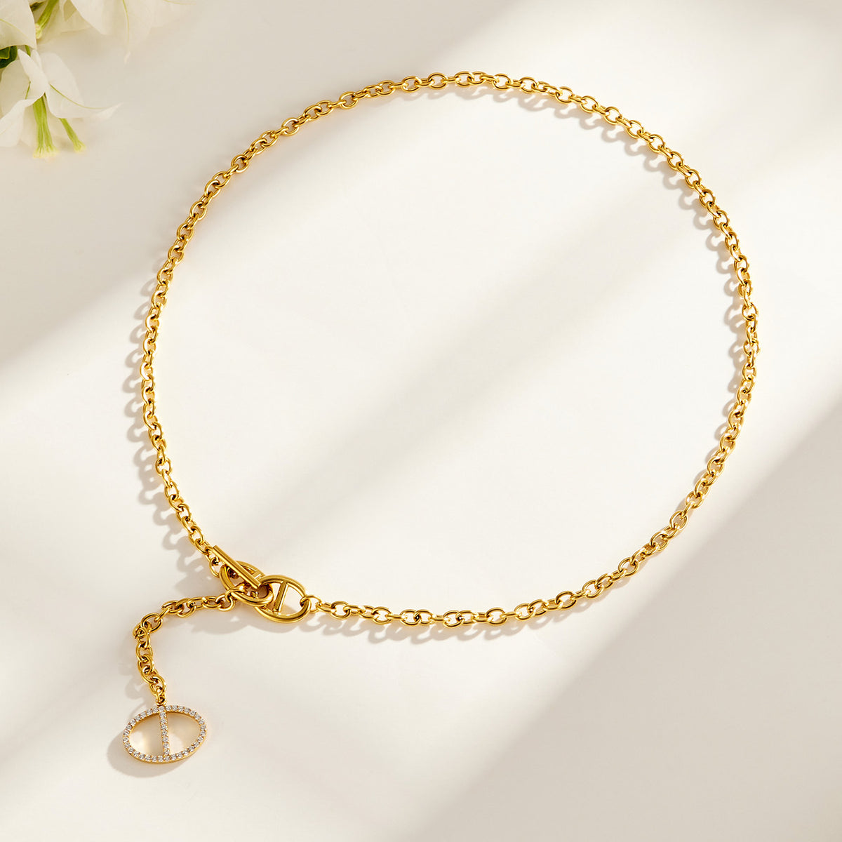 Short gold zircon toggle necklace with geometric drop pendant and link chain