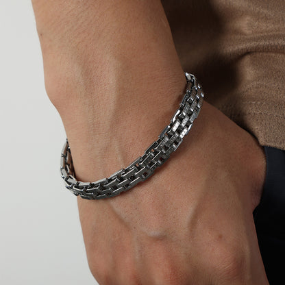 Silver stainless steel lobster clasp bracelet worn on wrist, 316L, waterproof and tarnish-resistant, stylish streetwear jewelry for men