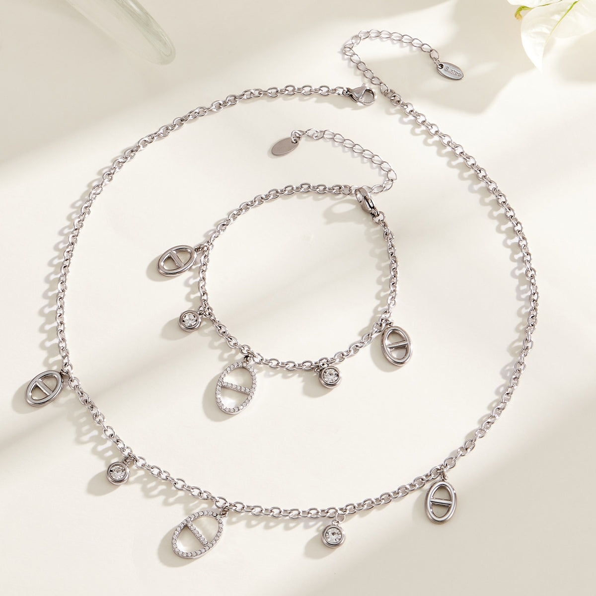 Silver stainless steel charm bracelet and necklace with zircon details