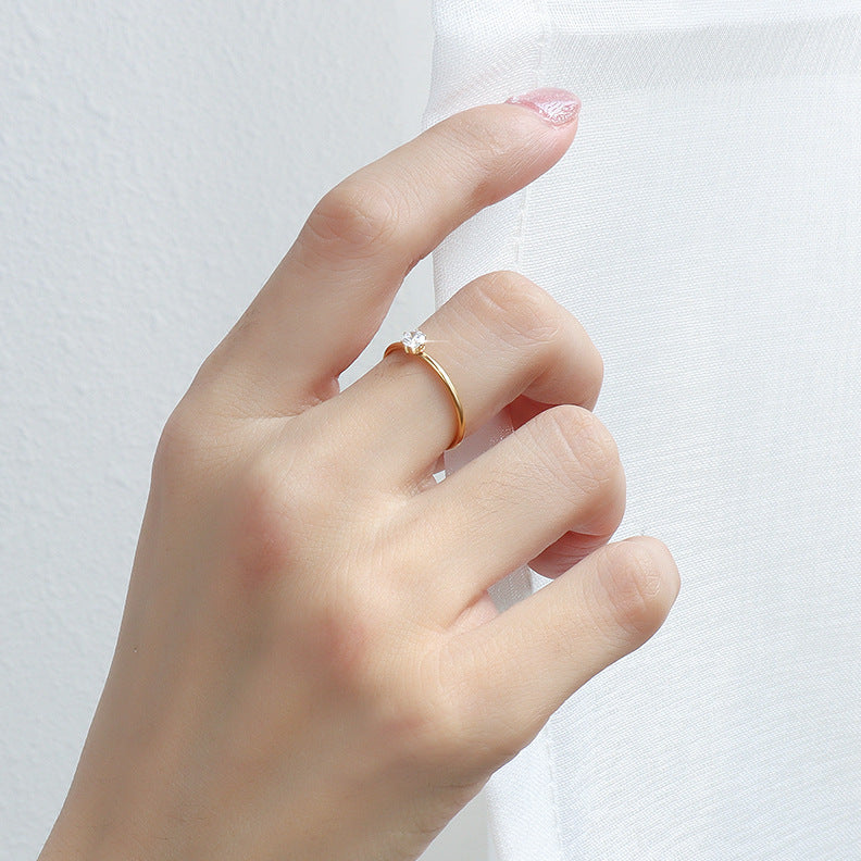 Minimalist stainless steel solitaire stacking ring worn on hand for wholesale jewelry buyers