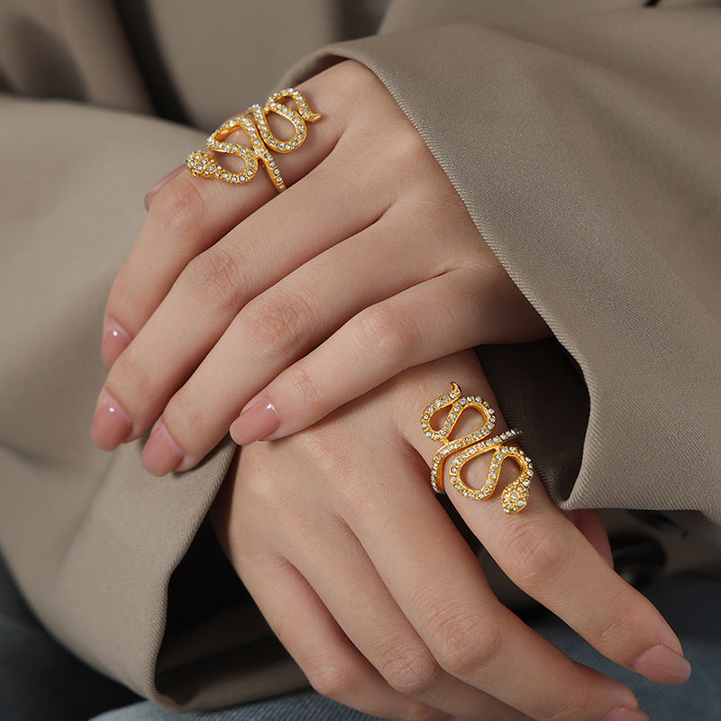 Model wearing a gold snake cubic zirconia ring on the hand