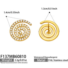 Close-up product display of gold spiral cubic zirconia stud earrings