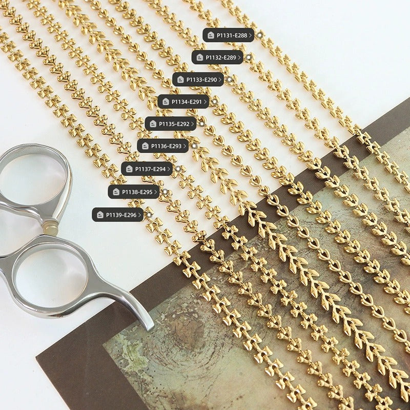 Stackable gold chain bracelets flat lay with multiple geometric link styles for wholesale jewelry displays