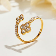 Side view of the A456 gold-tone double-flower open ring with clear-stone petals