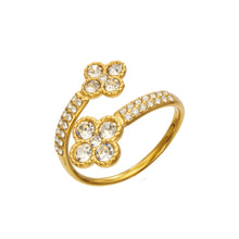 A456 gold-tone stainless steel open ring with two four-petal flowers on a white background