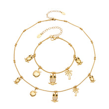 Stainless steel animal charm necklace and bracelet collection with gold-tone owl, apple and palm tree details