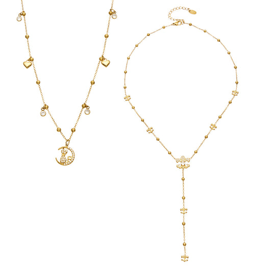 Gold-tone stainless steel cat moon pendant necklace beside an ornamental Y lariat necklace with beaded chain details