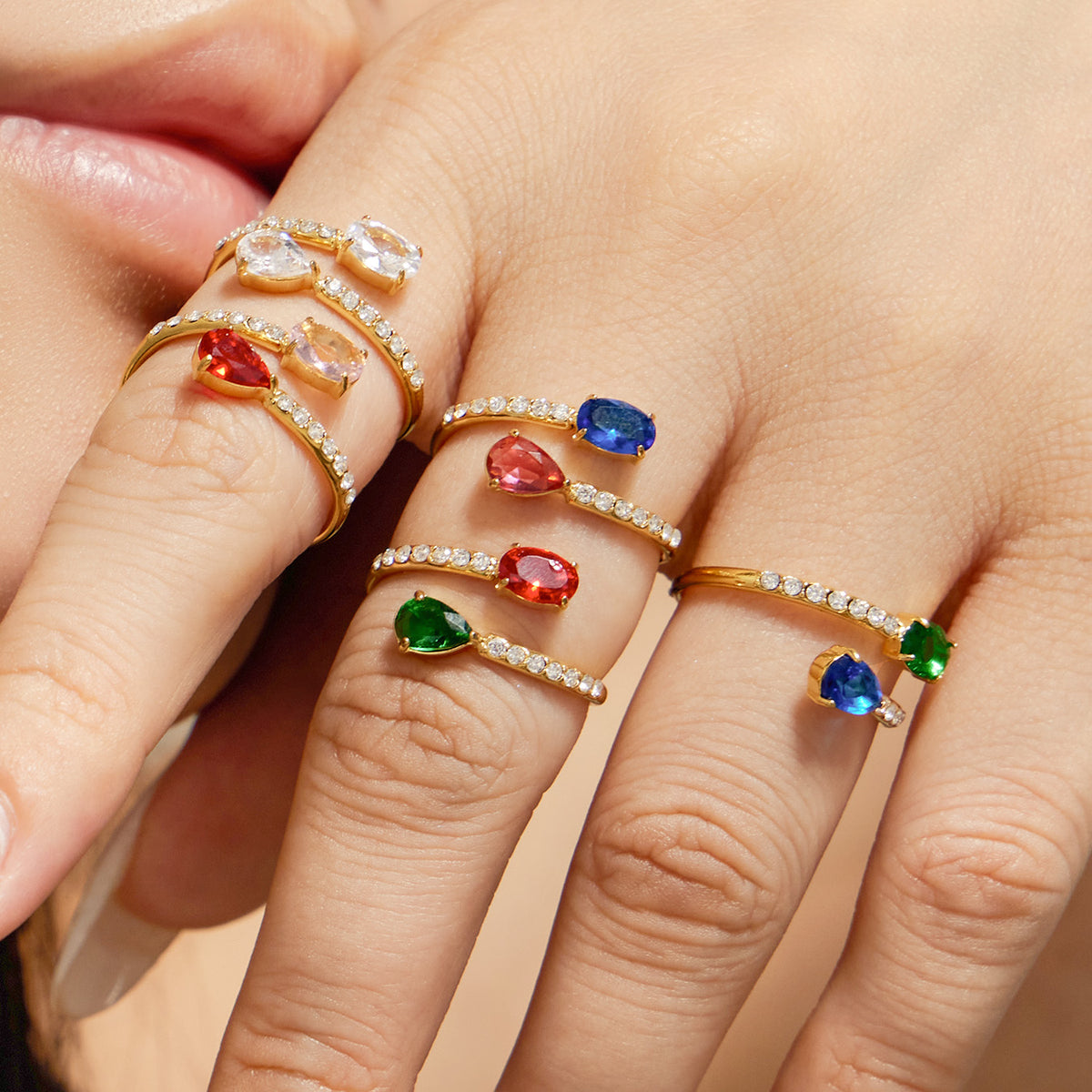 Stainless steel colorful glass open rings with white CZ accents worn together on hand