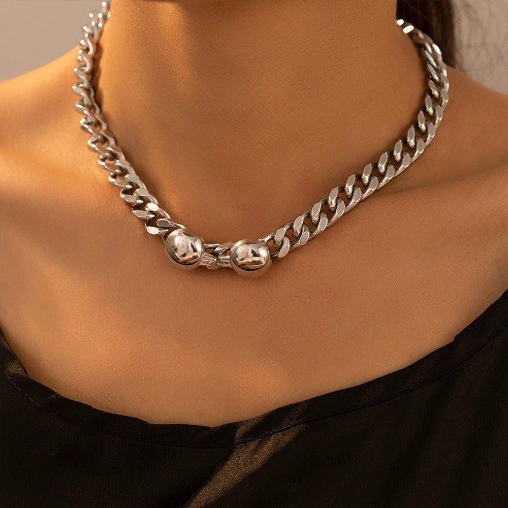 Close-up of stainless steel Cuban chain necklace with minimalist silver-tone finish for boutique jewelry collections