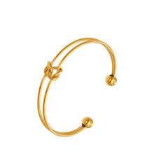 Gold-tone stainless steel double wire knot cuff bracelet with open bangle design