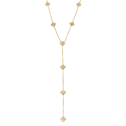 Stainless steel floral Y lariat necklace with delicate clear stone flower details in gold-tone finish