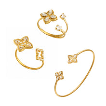 Stainless steel flower open ring and bangle styles displayed together in gold tone