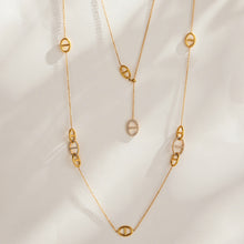 Gold-tone stainless steel geometric link Y necklace with circular link and drop pendant details