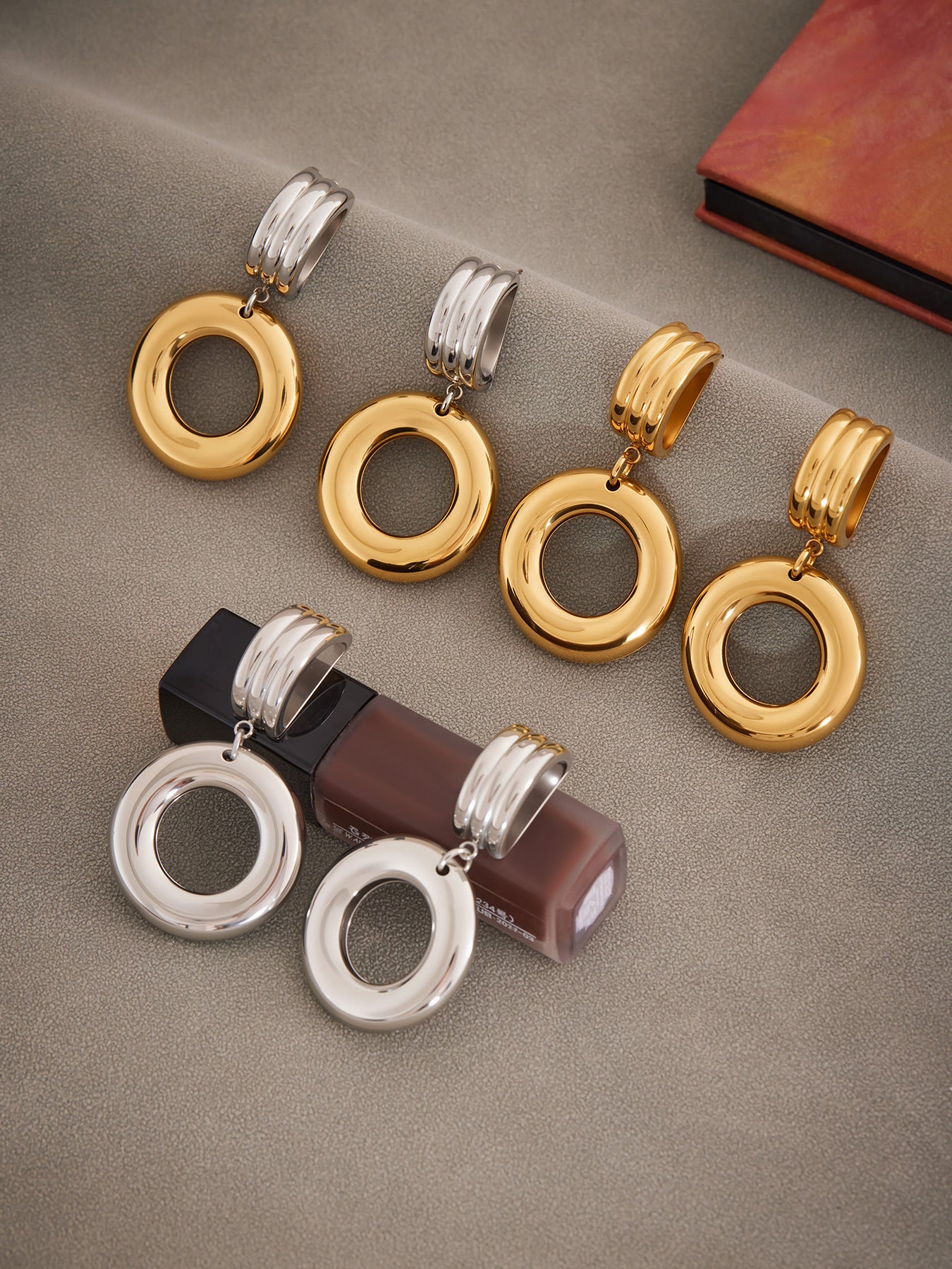 Round geometric statement earring assortment in gold, silver and two-tone stainless steel finishes