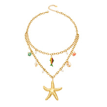 Stainless steel sea life charm necklace with starfish, fish, shell and faux pearl details