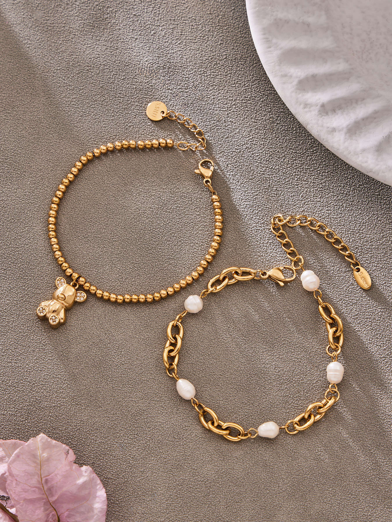 Model wearing 316L stainless steel 18K gold PVD zircon bear bracelet, playful minimalist design