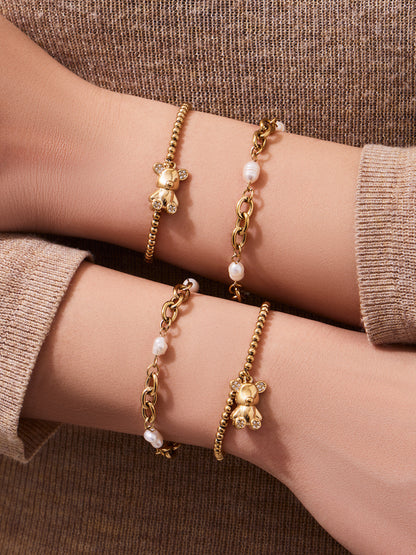 Detail of 316L stainless steel 18K gold PVD zircon bear bracelet, zircon-embellished bear charm
