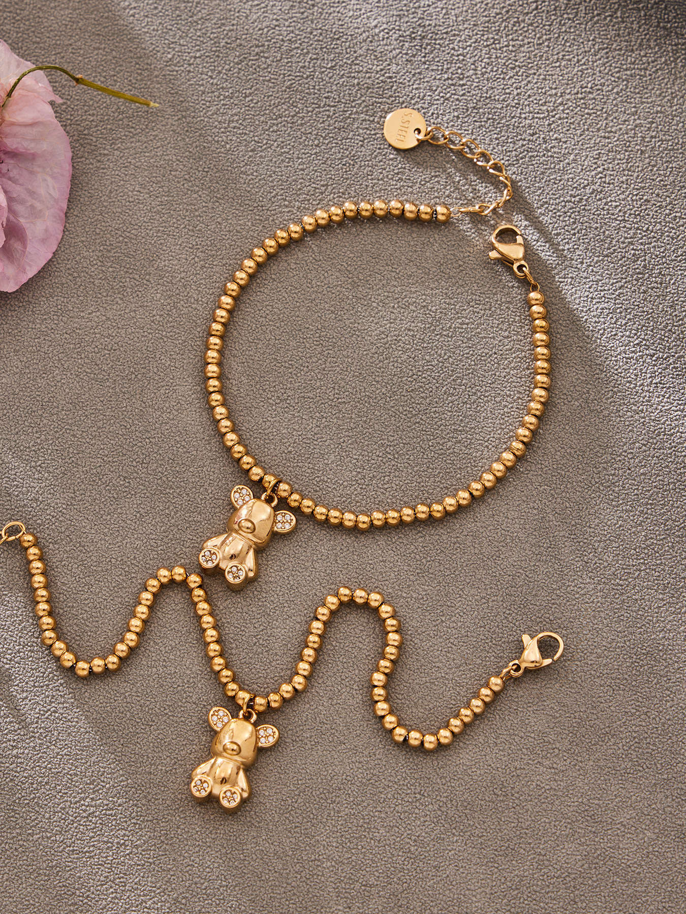 Lifestyle shot of 316L stainless steel 18K gold PVD zircon bear bracelet, waterproof for daily wear