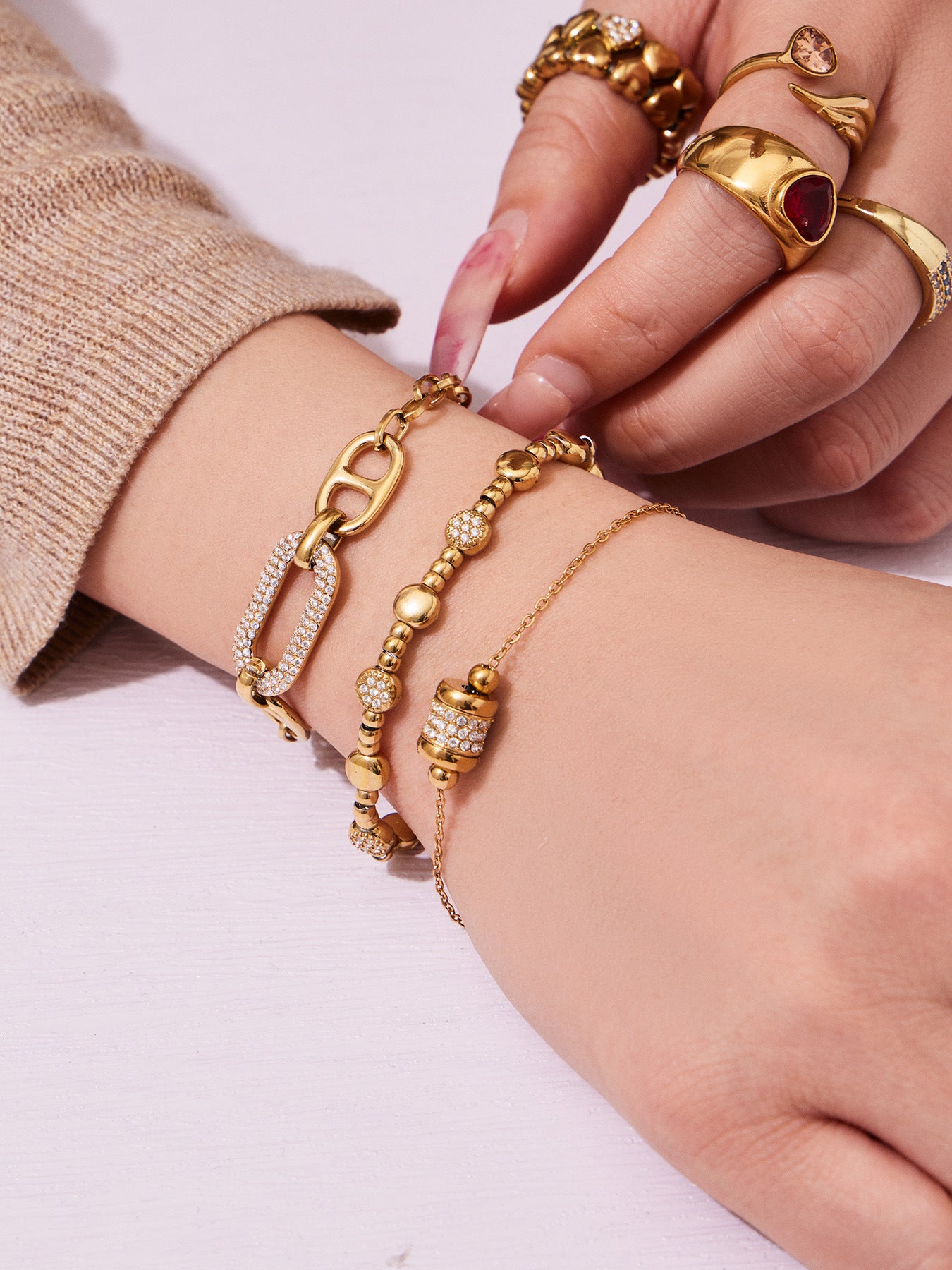 Model wearing 316L Stainless Steel 18K Gold PVD star bead bracelet, casual everyday waterproof jewelry