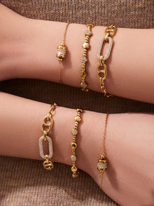 Model wearing 316L Stainless Steel 18K Gold PVD star bead bracelet, stacked with other waterproof bracelets