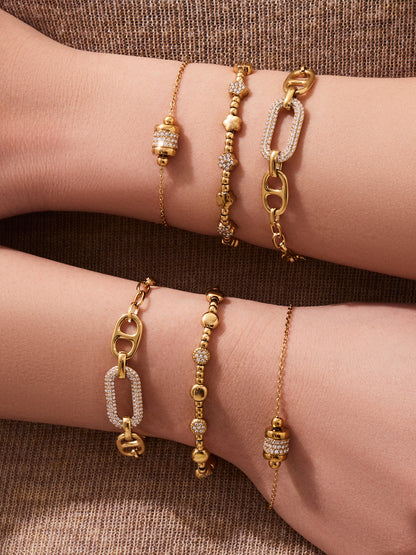 Model wearing 316L Stainless Steel 18K Gold PVD star bead bracelet, stacked with other waterproof bracelets