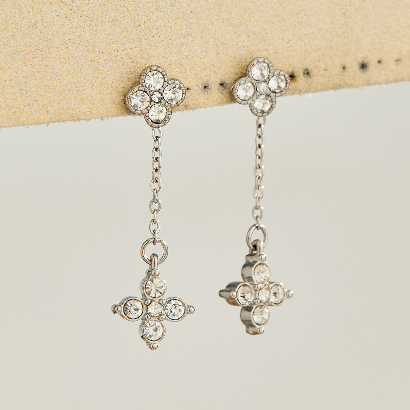 Steel-tone four-leaf clover drop earrings with clear cubic zirconia
