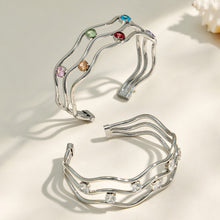 Polished steel three-layer open bangle with clear cubic zirconia accents