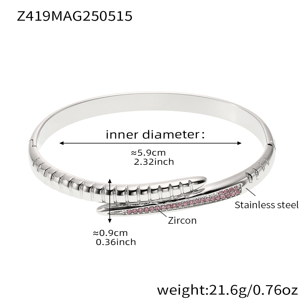 Steel-tone clear zircon nail bangle with a 5.9 cm inner diameter and 21.6 g weight