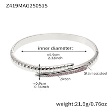 Steel-tone clear zircon nail bangle with a 5.9 cm inner diameter and 21.6 g weight