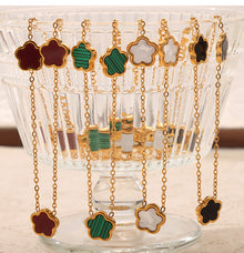 Red shell geometric floral necklace product card with 18K PVD gold finish