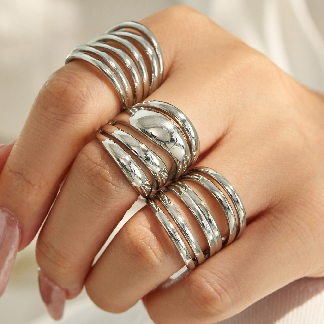 Model wearing steel tone 316L stainless steel multi-band open rings