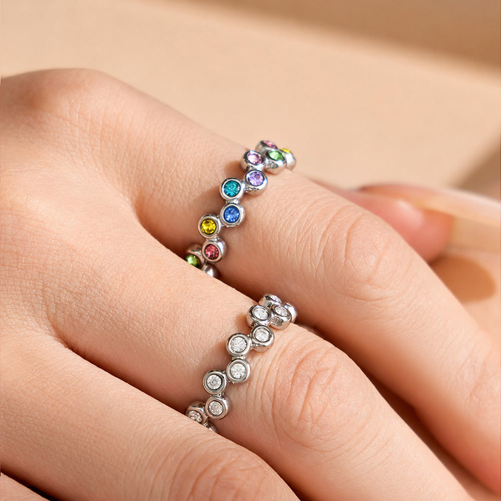 Model wearing a steel-tone multicolor cubic zirconia wide band statement ring