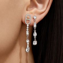 Model wearing steel rectangular-link cubic zirconia long drop earrings