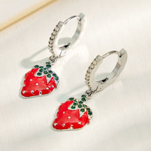Pair of polished steel strawberry charm huggie earrings with red fruit pendants