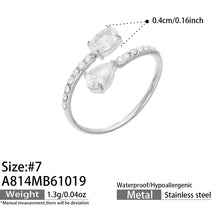 A814 steel-tone stainless steel adjustable open ring with clear glass and white cubic zirconia accents